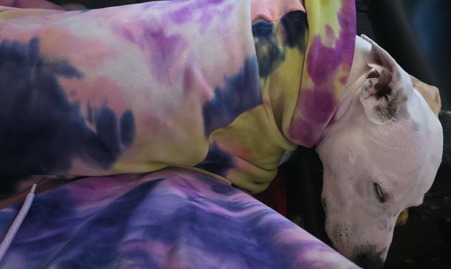 Girl in a tie-dye hoodie napping